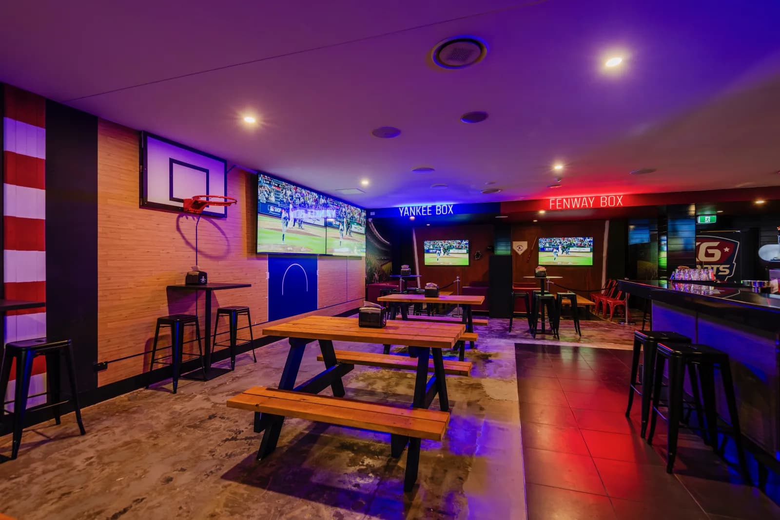 NBA and MLB themed seating areas inside KG Sports Bar